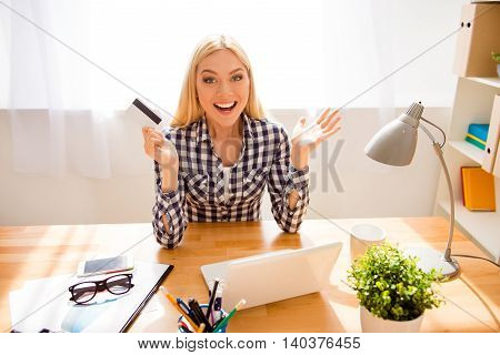 Portrait Of Happy Excited Woman Holding Bank Card