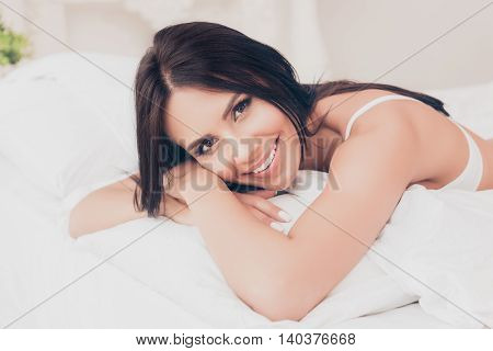 Portrait Of Young Pretty Woman Lying In Bed After Sleep