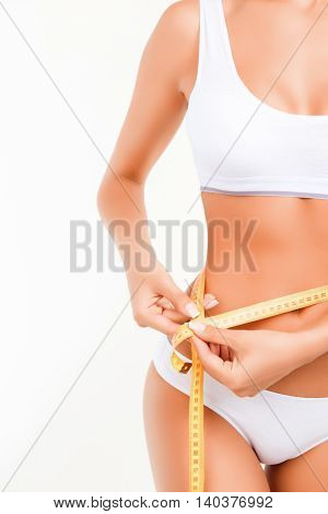 Photo Of Half Of Slim Woman Measuring Her Waist