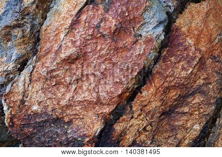 Background: stone picturesque relief,  multicolored rock texture