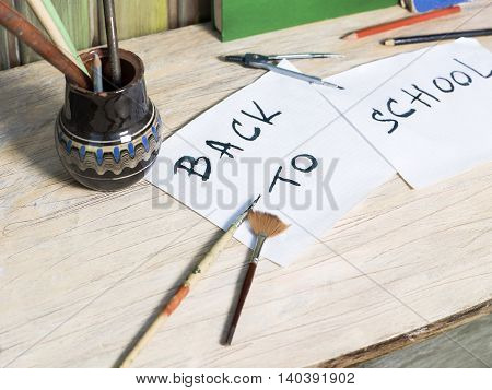 Various educational objects laid on the desk selective focus angled shot concept of back to school