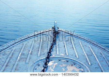 fore part of boat. head boat sailing on blue sea with anchor chain