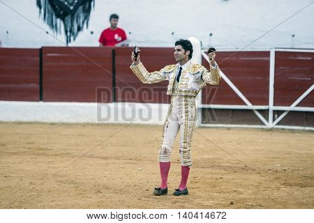 Sabiote SPAIN September 9 2011: The Spanish Bullfighter Cayetano Rivera to the turning of honour with an ear in his hand in the Bullring of Sabiote Spain