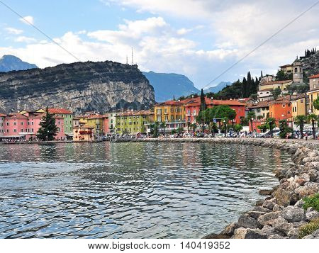 NAGO-TORBOLE ITALY - JULY 27: Promenade in old town of Nago-Torbole Italy on July 27 2014. Nago-Torbole is a resort on northern part of Garda lake in Italy.