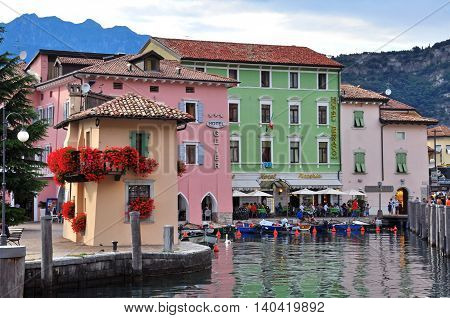 NAGO-TORBOLE ITALY - JULY 27: Colorful buildings in old town of Nago-Torbole Italy on July 27 2014. Nago-Torbole is a resort on northern part of Garda lake in Italy.