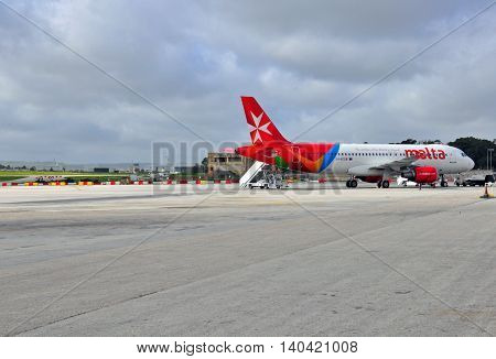 VALLETTA MALTA - FEBRUARY 17: Air Malta airbus going to depart from Luqa Malta airport on February 17 2014. Malta International Airport is the only airport in Malta and it serves the whole Maltese Archipelago.