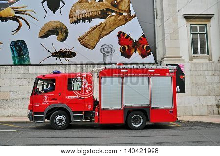 LISBON PORTUGAL - NOVEMBER 23: Fire truck of the fire department of portuguese Bombeiros on November 23 2012. A fire apparatus is a vehicle designed to assist in firefighting and other rescue operations.