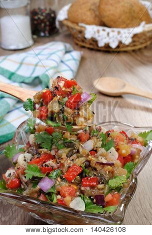 Salad of roasted eggplant with tomatoes peppers and cilantro
