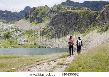 Two Girls Hiking In The Ayous Lakes Pyrenees, France