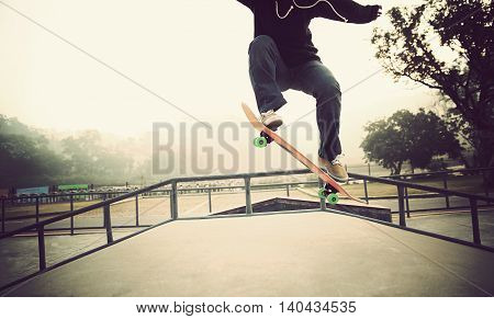 one young woman skateboarder skateboarding at skatepark