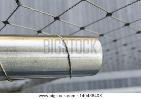 Thin stainless steel cable wraps stainless steel rail