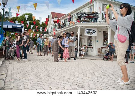 Tauranga, New Zealand - April 1, 2013;Tourists enjoying Tauranga Historic Village in Bay of plenty New Zealand popular tourist destination and host of National Jazz festival.