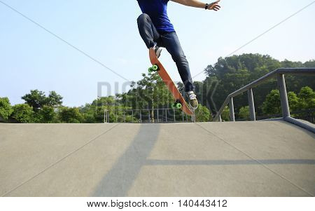 one young skateborder skateboarding at skatepark ramp