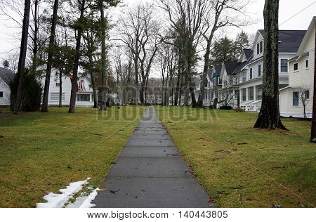 WEQUETONSING, MICHIGAN / UNITED STATES - DECEMBER 22, 2015: A sidewalk leads to homes from the beach in Wequetonsing, Michigan.