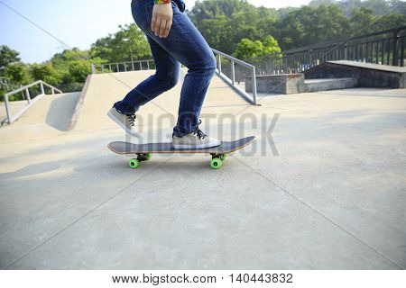 one young skateborder skateboarding at skatepark ramp