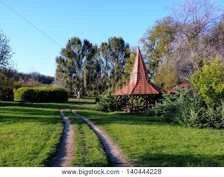 A pad with a little house in autumn