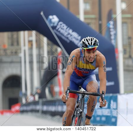 STOCKHOLM SWEDEN - JUL 02 2016: Male triathlete cyclists Luis Miguel Velasques in the Men's ITU World Triathlon series event July 02 2016 in Stockholm Sweden