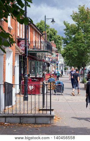Hartley Wintney/UK. 29th July 2016. The High Street in Hartley Wintney also carries the A30 trunk road through it. The village is within Hart District which for five years in a row has been voted the most desirable place to live in the UK for quality of l