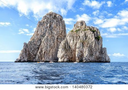The faraglioni of Capri Island, Italy. Faraglioni are stacks, a coastal rock formation eroded by waves. They are found at the coasts of several regions and the most famous are off the island of Capri.
