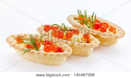 Tartlet with red caviar close up isolated on white background. Cocktail party snacks with red caviar gourmet food festive appetizer sample serving