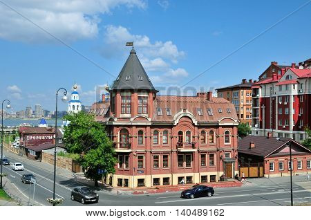 Kazan, Tatarstan, Russia - July 29, 2016. Crossroads Street Baturin and Karl Marx Street, a beautiful corner house at number 1. The stylized inscription on a small two-story building 