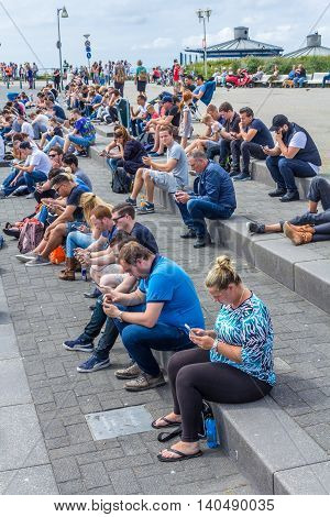 Amsterdam the Netherlands - July 13 2016: Pokémon GO hot spot at Kijkduin The Hague the Netherlands
