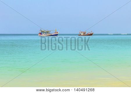 two fishing boat at sea in phuket Thailand and sky blue