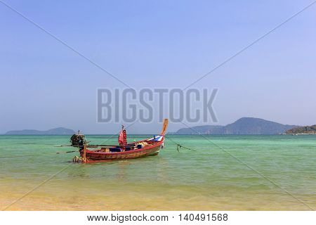 long tail boat at sea in phuket Thailand and sky blue