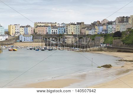 An image of the colorful Tenby Harbor shot at Tenby, Penbrokeshire, South Wales, UK