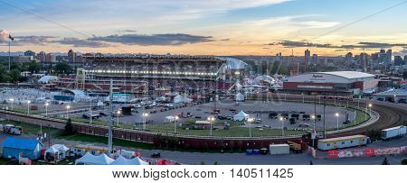 CALGARY, CANADA - JULY 8: Panoramic view of the the Calgary Stampede at sunset on July 8, 2016 in Calgary, Alberta. The Calgary Stampede is often called the greatest outdoor show on Earth.