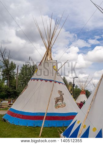 CALGARY, CANADA - JULY 9: View of Tipis in the Indian Village at the Calgary Stampede on July 9, 2016 in Calgary, Alberta. The Indian Village represents First Nations people at the Calgary Stampede.