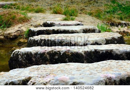 closeup of stepstones crossing a small river