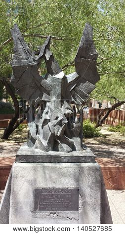 PHOENIX AZ - JULY 29 2016: Rising Phoenix art work by Ed Mell set in a small green park near historic Phoenix City Hall.