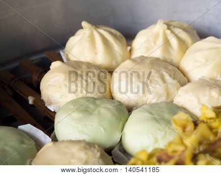 Local Chinese food steamed dumplings or steamed buns steaming in pot. (selective focus)