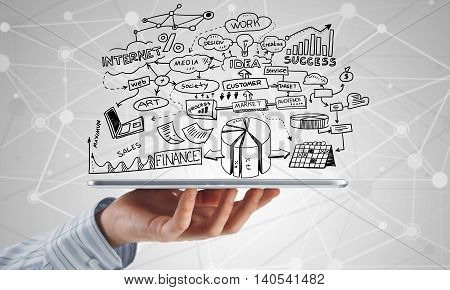 Businessman hand demostrating business strategy plan on tablet screen
