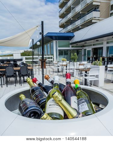 Kijkduin the Netherlands - July 30 2016: wine bottles in a cool box at a beach side hotel