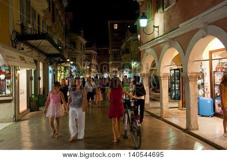 CORFU-AUGUST 25: Crowd of tourists on Kerkyra street at night on August 25 2014 in Kerkyra town on the Corfu island Greece.