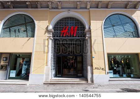 ATHENS-AUGUST 22: H&M store facade on Emrou street on August 222014 Athens Greece. H & M is a Swedish retail-clothing company known for its fast-fashion clothing for men women and children.