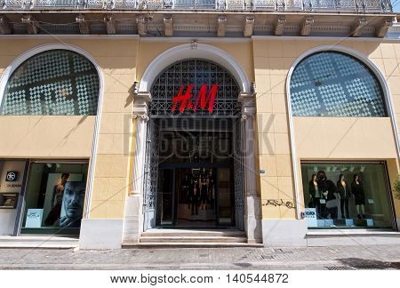 ATHENS-AUGUST 22: H&M store building on Emrou street on August 222014 Athens Greece. H & M is a Swedish retail-clothing company known for its fast-fashion clothing for men women and children.