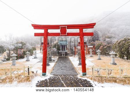 Close up of beautiful red wooden torii in japanese shrine on kumamoto moutain japan.