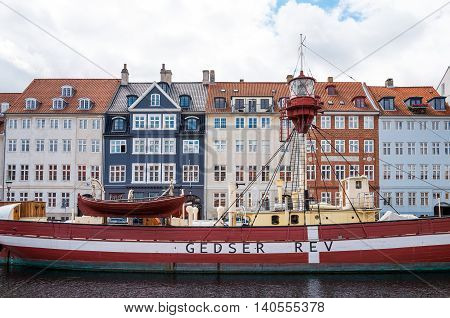 Copenhagen Denmark - July 20 2015: Traditional houses and boats in the Nythavn canal