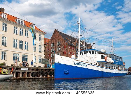 Copenhagen Denmark - July 22 2015: Traditional houses and boats in the Nythavn canal