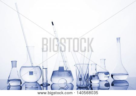 Test-tubes On A White And Blue Background.