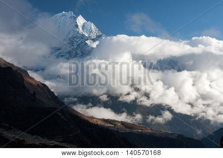 View of Thamserku over Portse village from route to Gokyo Solukhumbu Nepal.