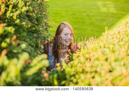Girl Looks Out Of Bushes Near The Castle