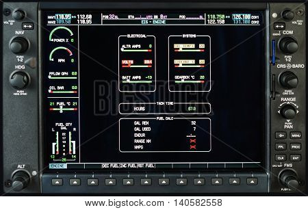 Airplane glass cockpit display G1000 with weather radar and engine gauges in small private airplane