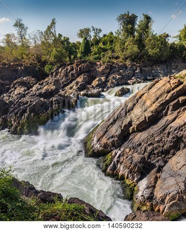 turbulent strong river waterfull in the Laos
