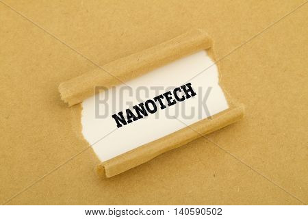 Nanotech word written under torn paper .