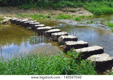 closeup of stepstones crossing a small river