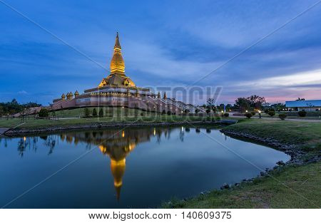 Maha Mongkol Bua Pagoda in Roi-ed Thailand at sunset